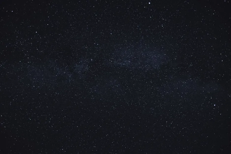 A dense cluster of stars against a dark night sky