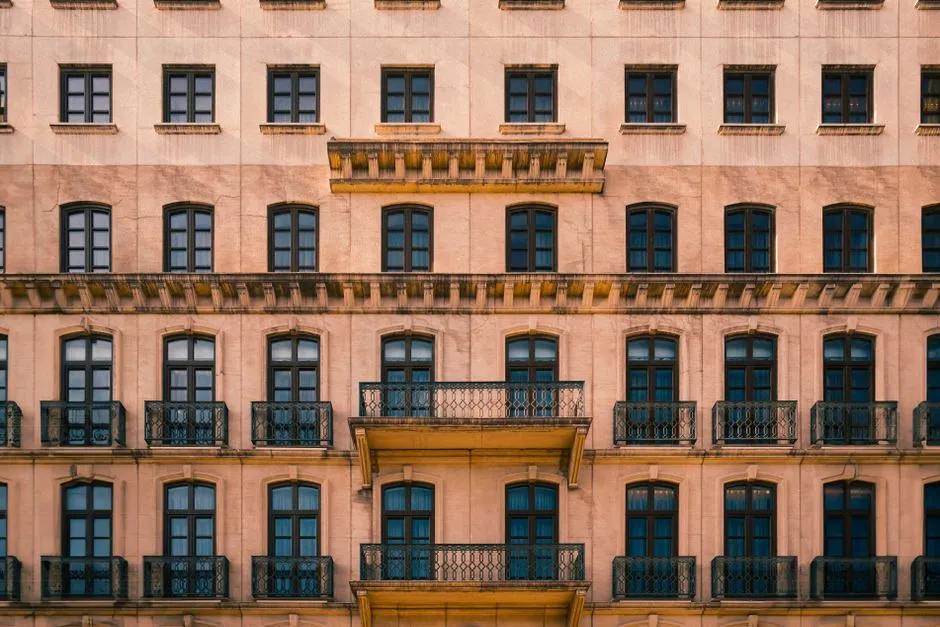 Elegant symmetrical building facade with repeating classic balconies